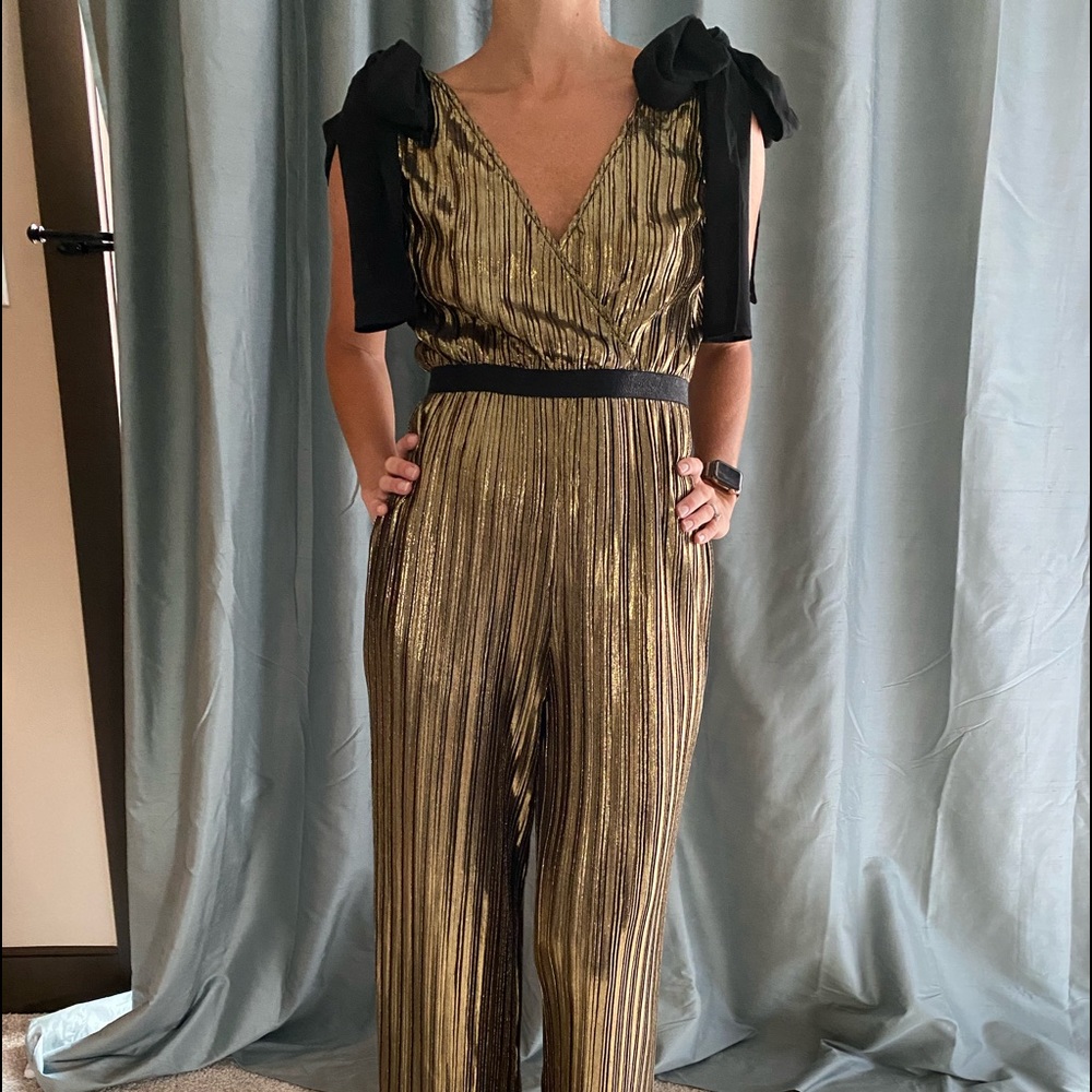 Brand new, never been worn gold and black romper